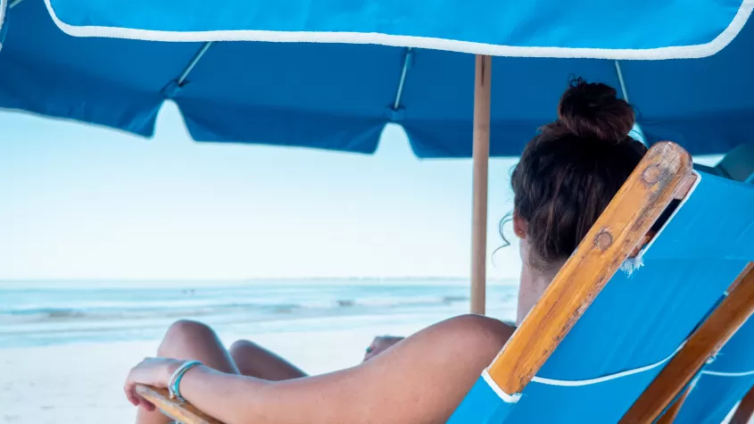 Relax under the shade of our oversized beach umbrella