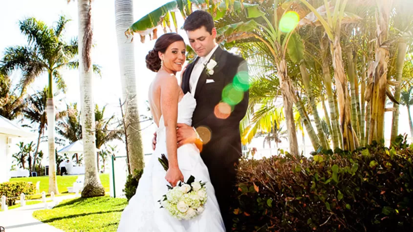 Wedding couple under palms