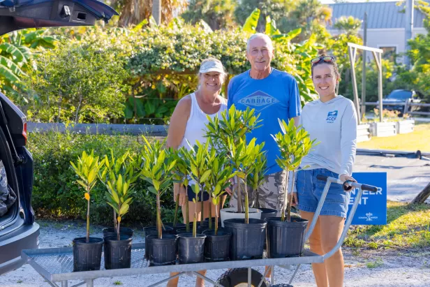 people smiling with mangroves
