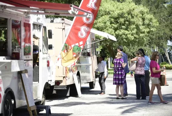 Group of people eating at a food truck